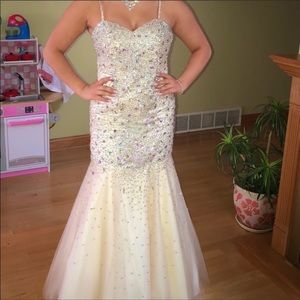Cream colored bedazzled floor length dress, mermaid style with straps